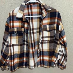 a multicolored flannel brand new and has been worn once